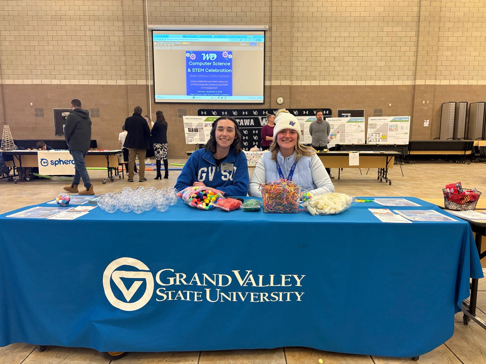 Two PCE Outreach staff members tabling at 2025 North Godwin STEM Night